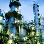 stock-photo-column-tower-in-petrochemical-plant-at-twilight-106756229